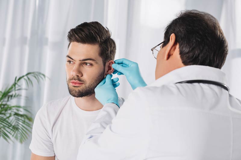 Doctor Examining Patient with ear infection