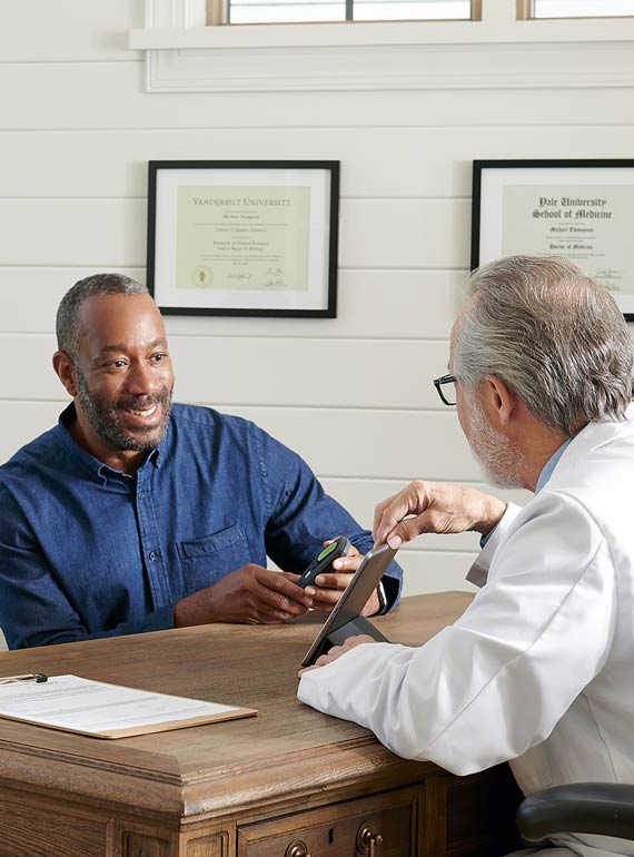 Doctor with patient in office