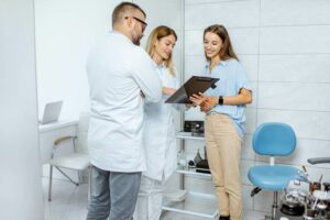 Medical team reviewing patient with tongue tie & swallowing disorder