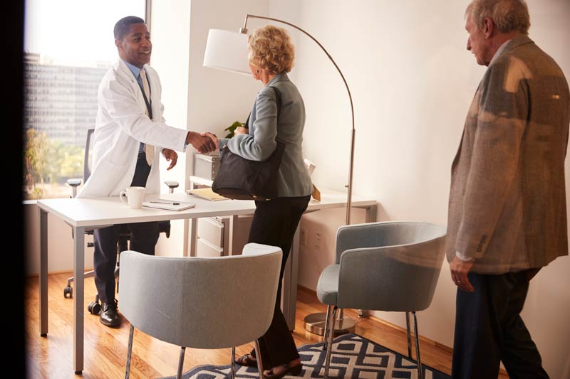 Senior couple meeting with doctor