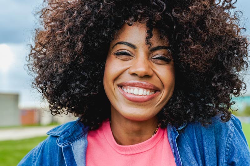 Young afro latina woman smiling