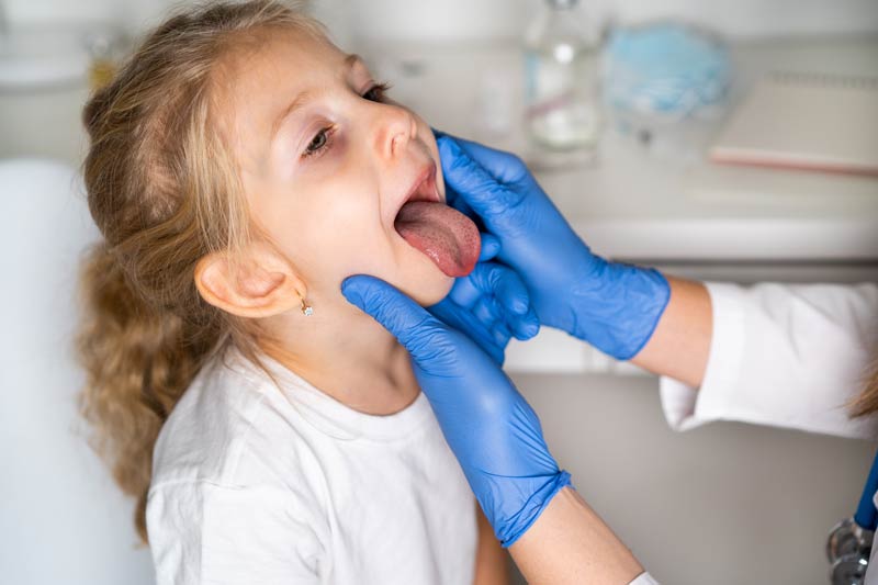 Young child getting sinusitis exam