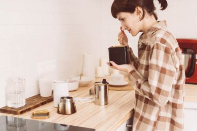 Woman sniffing coffee